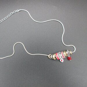 Silver-toned Adjustable Necklace with Red, silver, & Rhinestone Charms